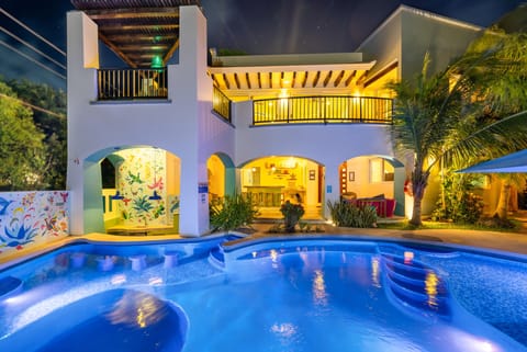 Main pool and vestibule at night.