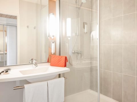 Shower, eco-friendly toiletries, hair dryer, towels