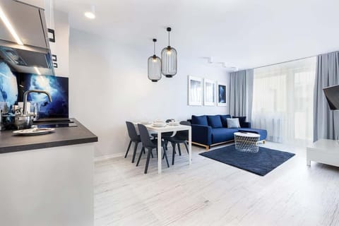 Living room with a comfortable sofa and TV. 