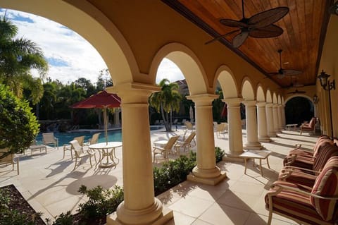 Loggia exit from clubhouse with pool deck visible to left