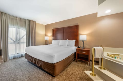 Desk, laptop workspace, blackout drapes, iron/ironing board