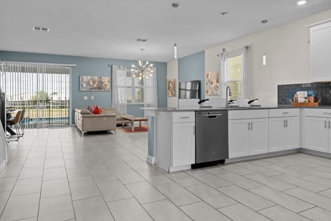 You'll love cooking in this modern kitchen with granite counters and stainless appliances, flowing seamlessly into your bright living space.