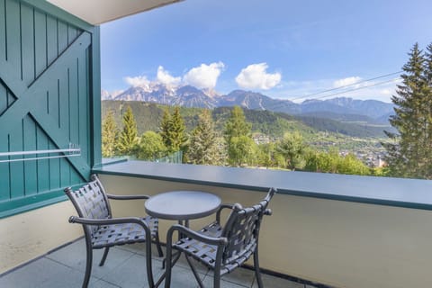 Enjoy stunning alpine views from your private balcony, a serene spot for morning coffee or après-ski evenings.