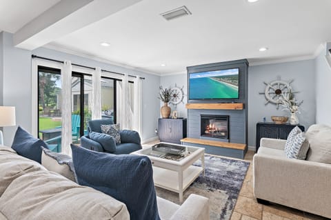 Living Area, with Fireplace, and Access to Patio