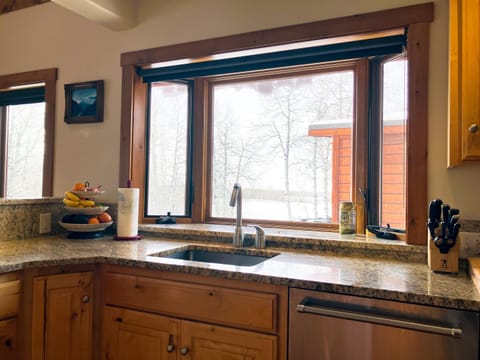 The updated kitchen features new appliances, microwave, and a mountain view!