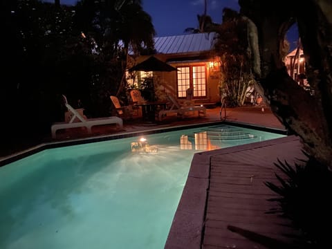 French doors open to heated  pool in front, and to private deck in back of unit