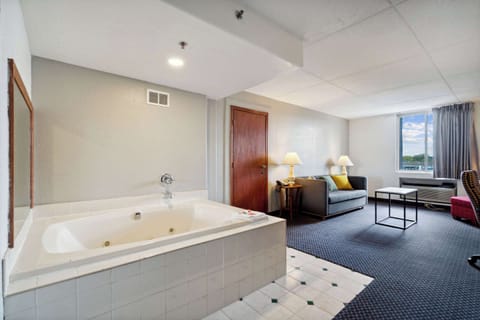 Suite, Multiple Beds, Non Smoking | In-room safe, desk, laptop workspace, iron/ironing board
