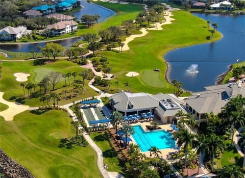 SB121 - Aerial view of the Stoneybrook clubhouse with pool and golf course