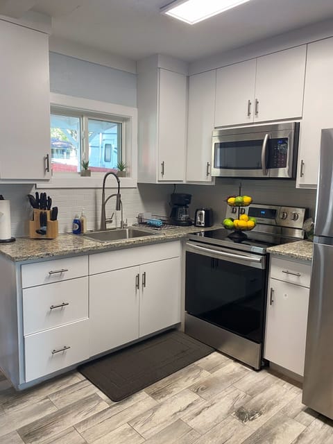 Open kitchen with stainless steel appliances