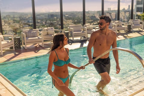 Outdoor pool, open 7:00 AM to 7:00 PM, pool umbrellas, sun loungers