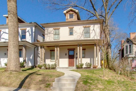 Charming porch with rockers in front.
