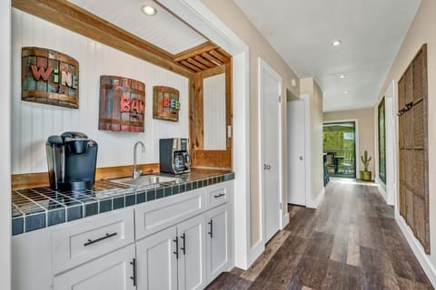 Entrance with coffee bar and coat hooks. 