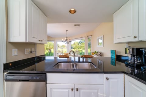 Bright, open kitchen with counter height seating for 2