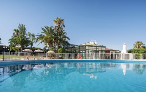 Seasonal outdoor pool, pool umbrellas, sun loungers