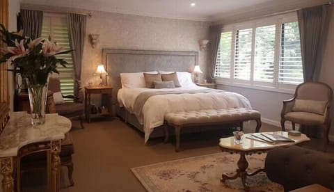 Enjoy the private, romantic bedroom with views across the English Garden