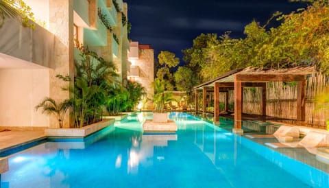 Enjoy the suspended net loungers just over the pool