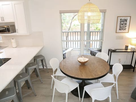 - Mornings with coffee at the breakfast bar or gather for games around the cozy round table - Plenty of seating for meals, laughs, & quality time with family or friends - Natural light, stylish touches, & a view that invites you to linger a little lo