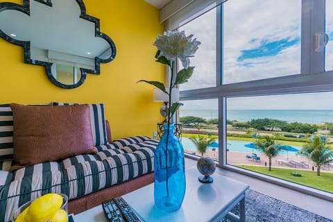 A bright, cheerful space where you can unwind with stunning views of the pool and ocean, bringing tropical tranquility right to your window.