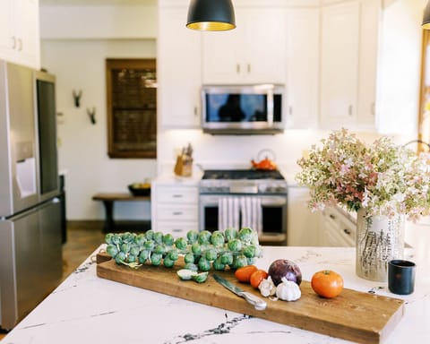 Mudroom located behind the kitchen with plenty pantry space.