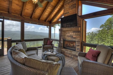 Relax in the screened in porch and watch the sunset while cozying up to the wood fireplace. 