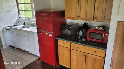 Nicely equipped kitchen with coffee maker, microwave, and toaster oven..