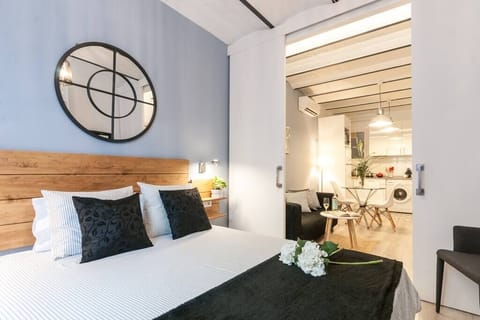 Double bed room with big closet and modern decoration. The window is facing the interior patio 