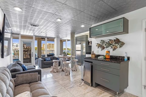 Open living space w/ tile floors, comfy seating, & a relaxed coastal vibe.