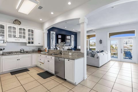 Clean, modern kitchen w/ ample counter space & room to gather.