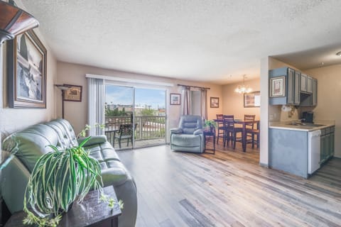 Relax in your bright, open living space with comfortable seating, dining area, and kitchen. Step onto your private balcony to enjoy the view.