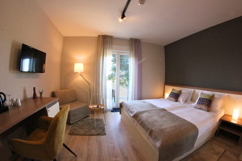 Classic Double Room, 1 King Bed, Balcony, Partial Sea View | In-room safe, desk, free WiFi, bed sheets