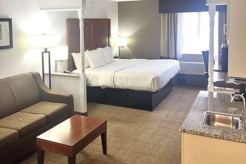 Desk, laptop workspace, blackout drapes, iron/ironing board