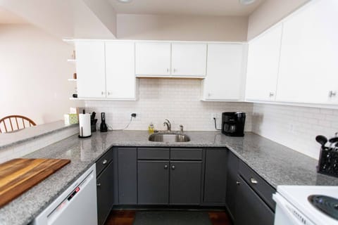 Kitchen with all appliances, Coffee Maker, dishes, cups, plates, pots and pans.