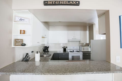 Kitchen and breakfast bar area, charging stations.