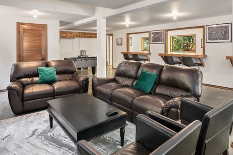 Highlander Lodge: - Garage game room with a comfortable TV Lounge.