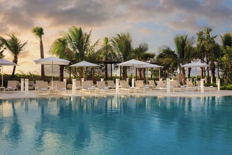 Outdoor pool, open 10:00 AM to 6:00 PM, cabanas (surcharge)