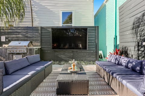 The outdoor living room has seating for 10 and features a huge 75" HDTV.