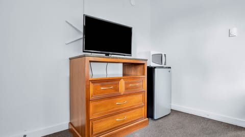 Desk, laptop workspace, blackout drapes, iron/ironing board