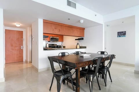 Gather around the table in this clean, modern dining space with easy kitchen access. Great for home-cooked meals and long stays in a well-equipped vacation rental.

