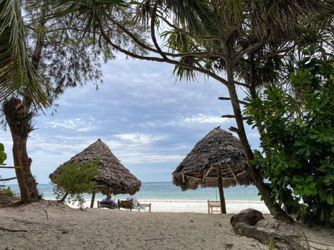 Beach nearby, white sand, beach towels