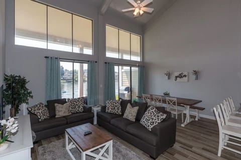 Stunning living room/dining area with beautiful views of the water!