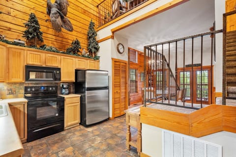 Cabin One Kitchen, stairs leading to Loft Bedrooms
