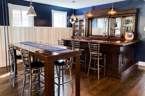 Celebrate at the custom bar and dining area that greets you!