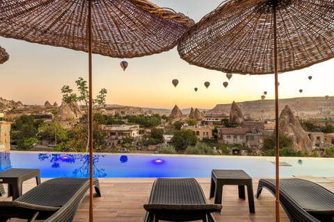 Seasonal outdoor pool, open 10:30 AM to 7 PM, pool umbrellas