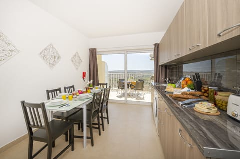 Fully equipped kitchen and dining area with panoramic views