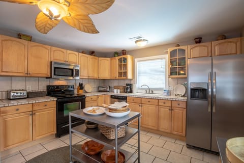 Spacious kitchen upstairs with full-size appliances