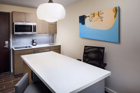 Hypo-allergenic bedding, desk, laptop workspace, blackout drapes