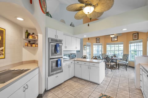 Microwave, Toaster Oven, two coffee makers, tea kettle, and complete cookware