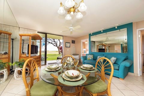 Inviting living and dining area with Smart TV and sliding doors to the lanai.