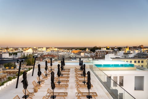 Indoor pool, outdoor pool, pool umbrellas, sun loungers