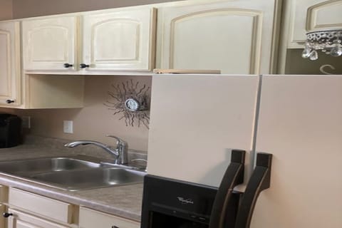 Kitchen with on-door icemaker and water